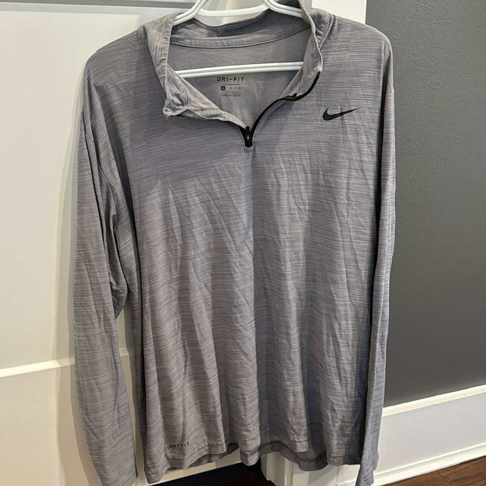 Nike. Men’s, DRI FIT, gray pullover w/ zipper @ neck.